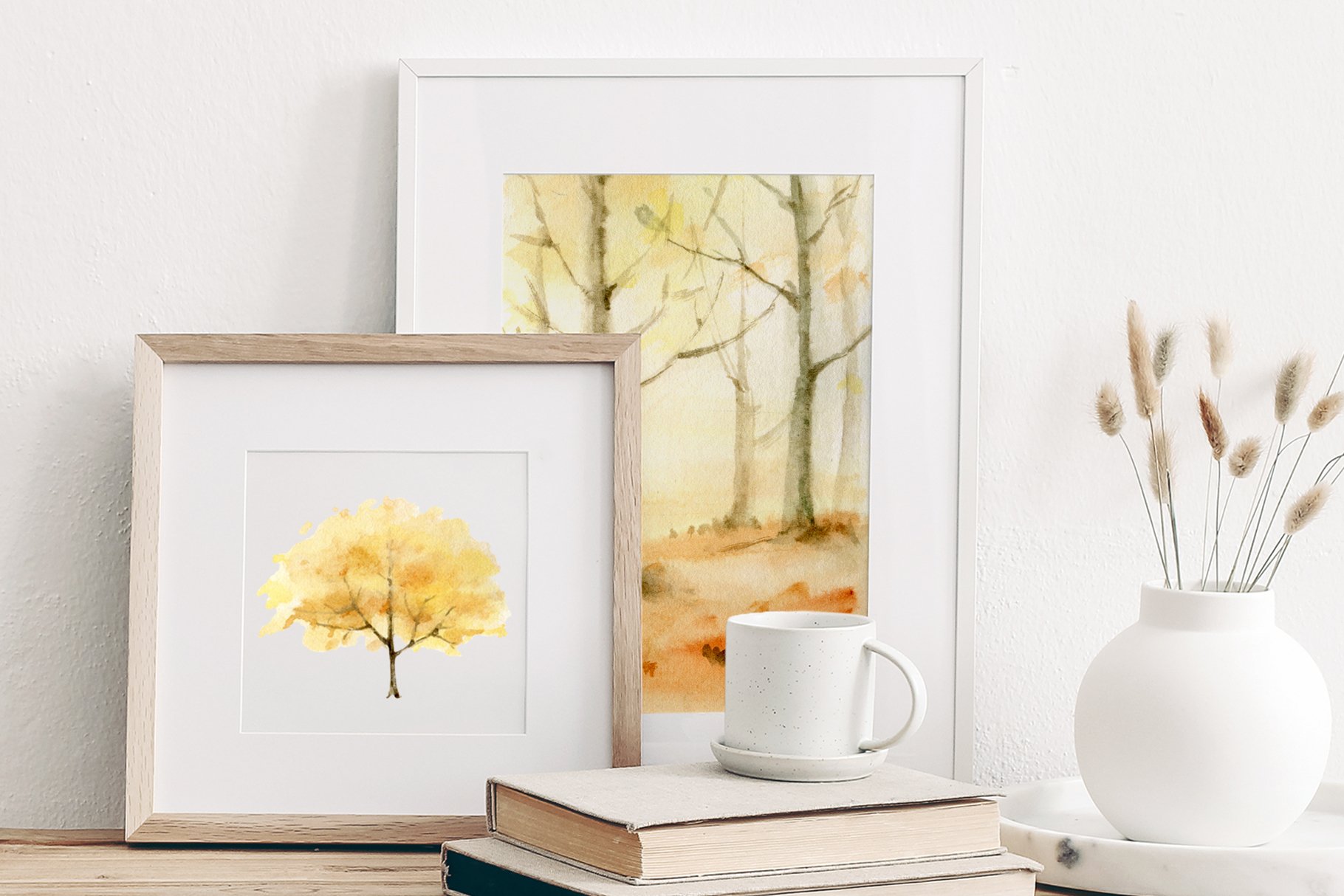 Painting of a yellow tree next to a cup of coffee.