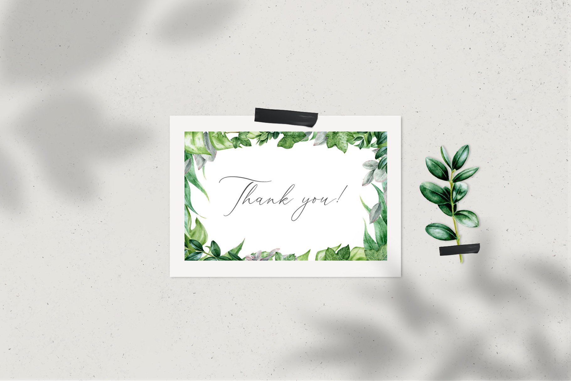 Card with the words thank you on it next to a plant.