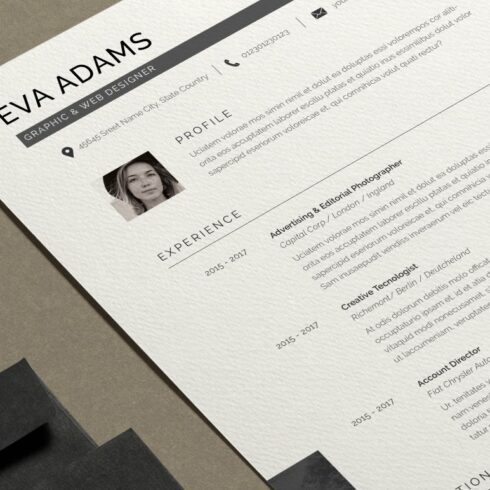 Professional resume is displayed on a desk.