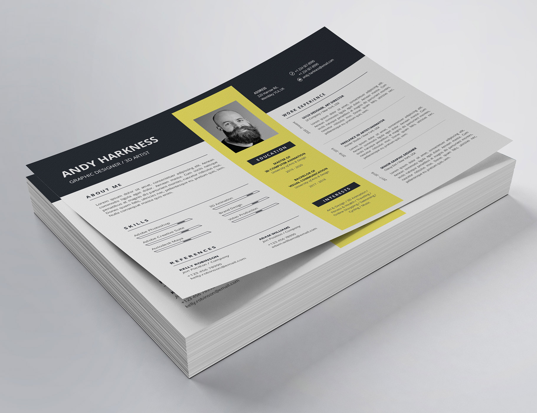 Yellow and black resume on top of a stack of papers.