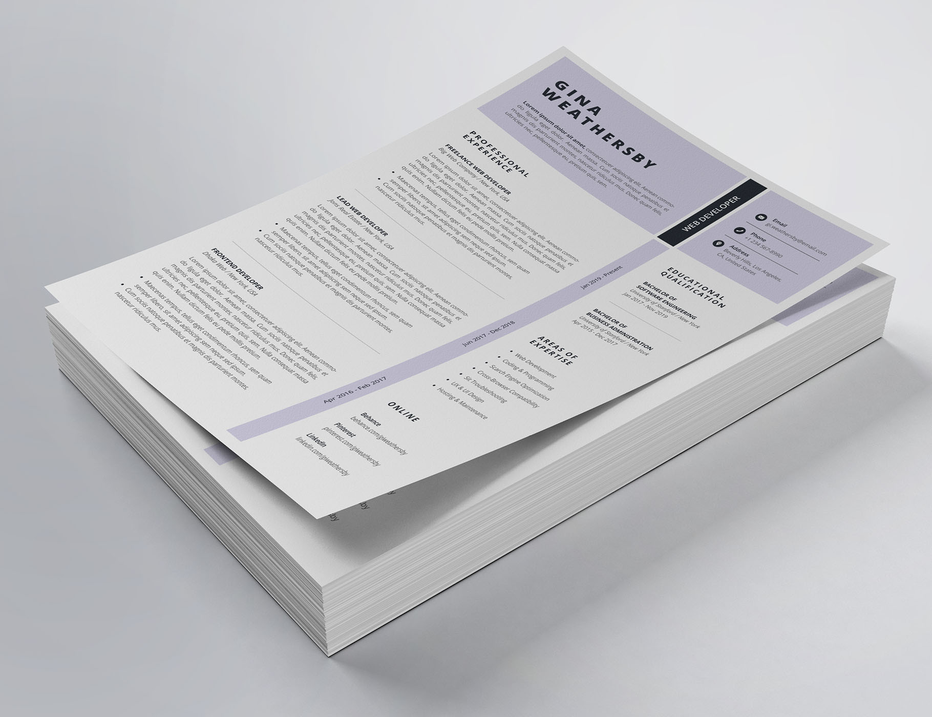 Stack of white paper with a purple and black design.