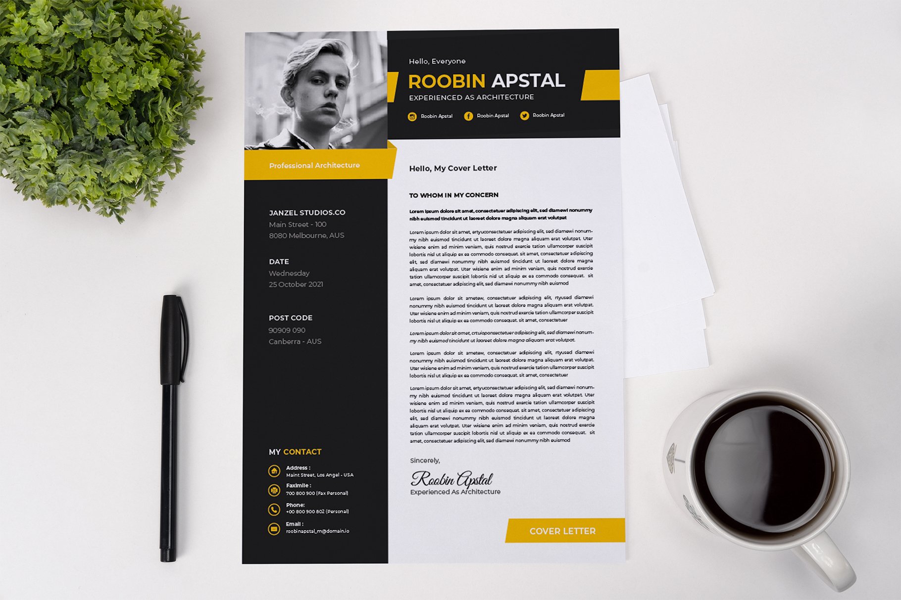 Black and yellow resume on a table next to a cup of coffee.