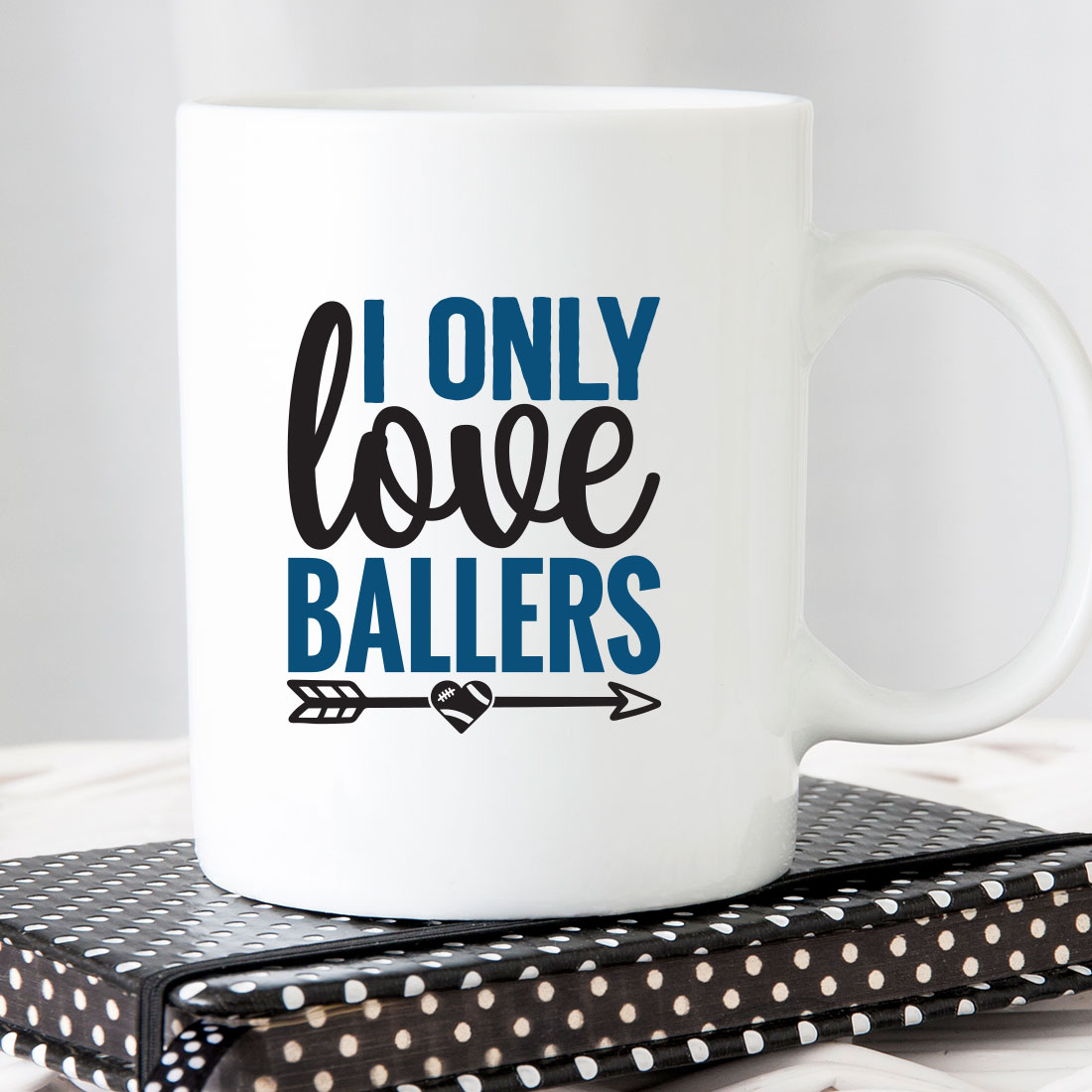 White coffee mug that says i only love ballers.