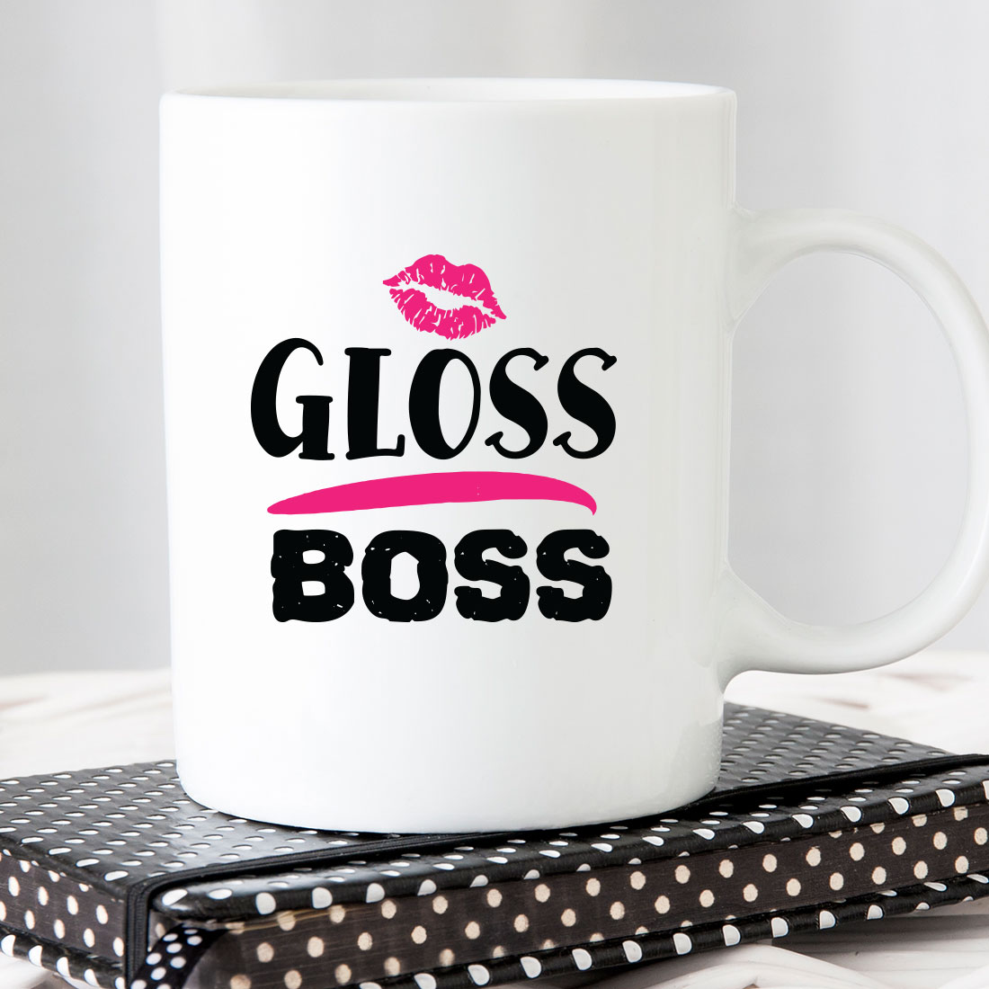 White coffee mug with the words gloss boss on it.