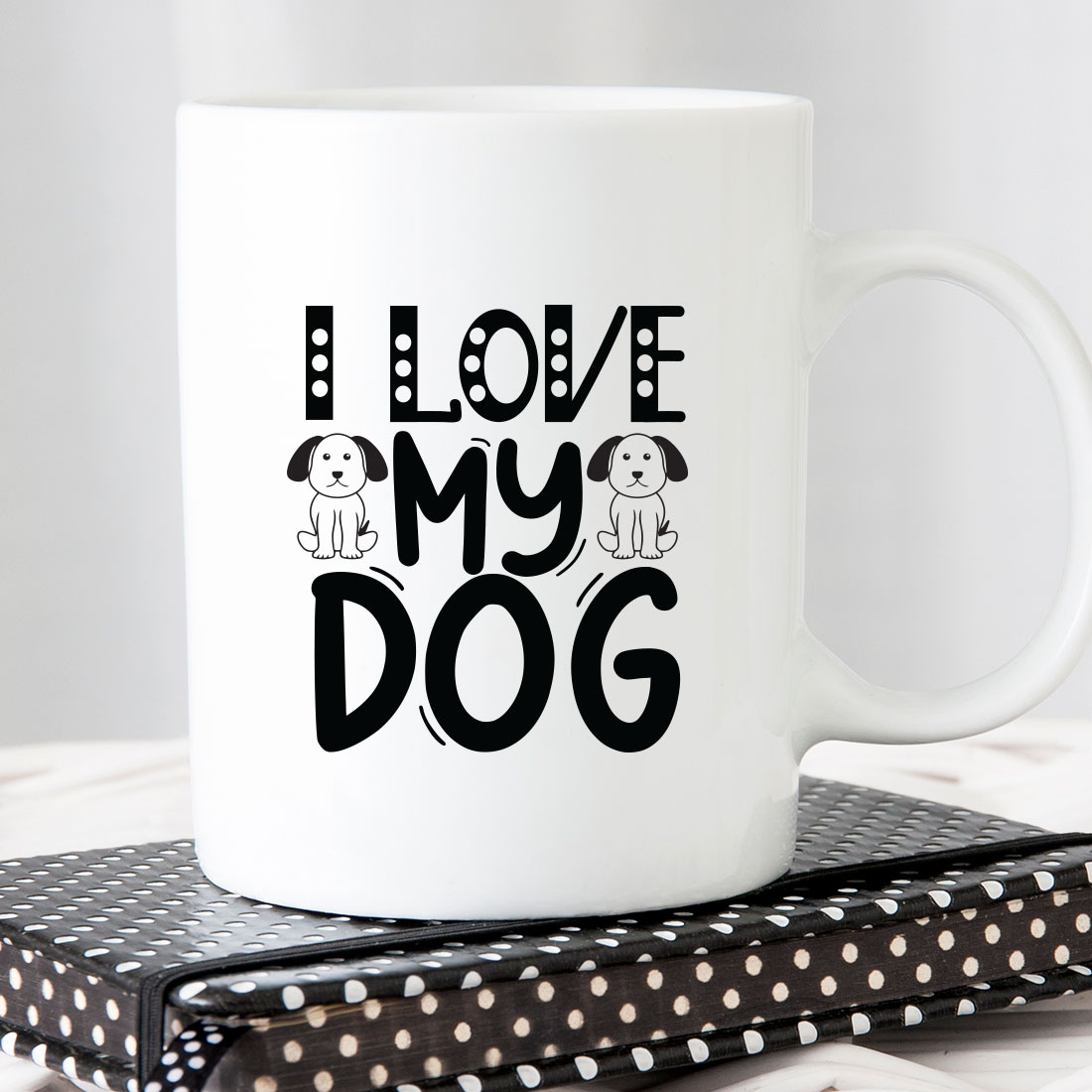 White coffee mug that says i love my dog.