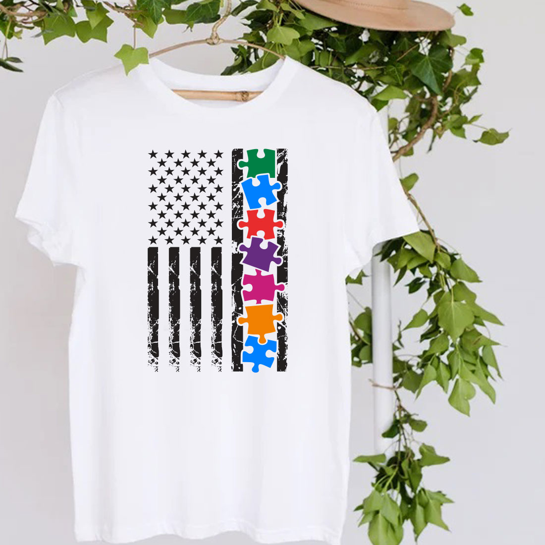 White t - shirt with a puzzle piece on it.