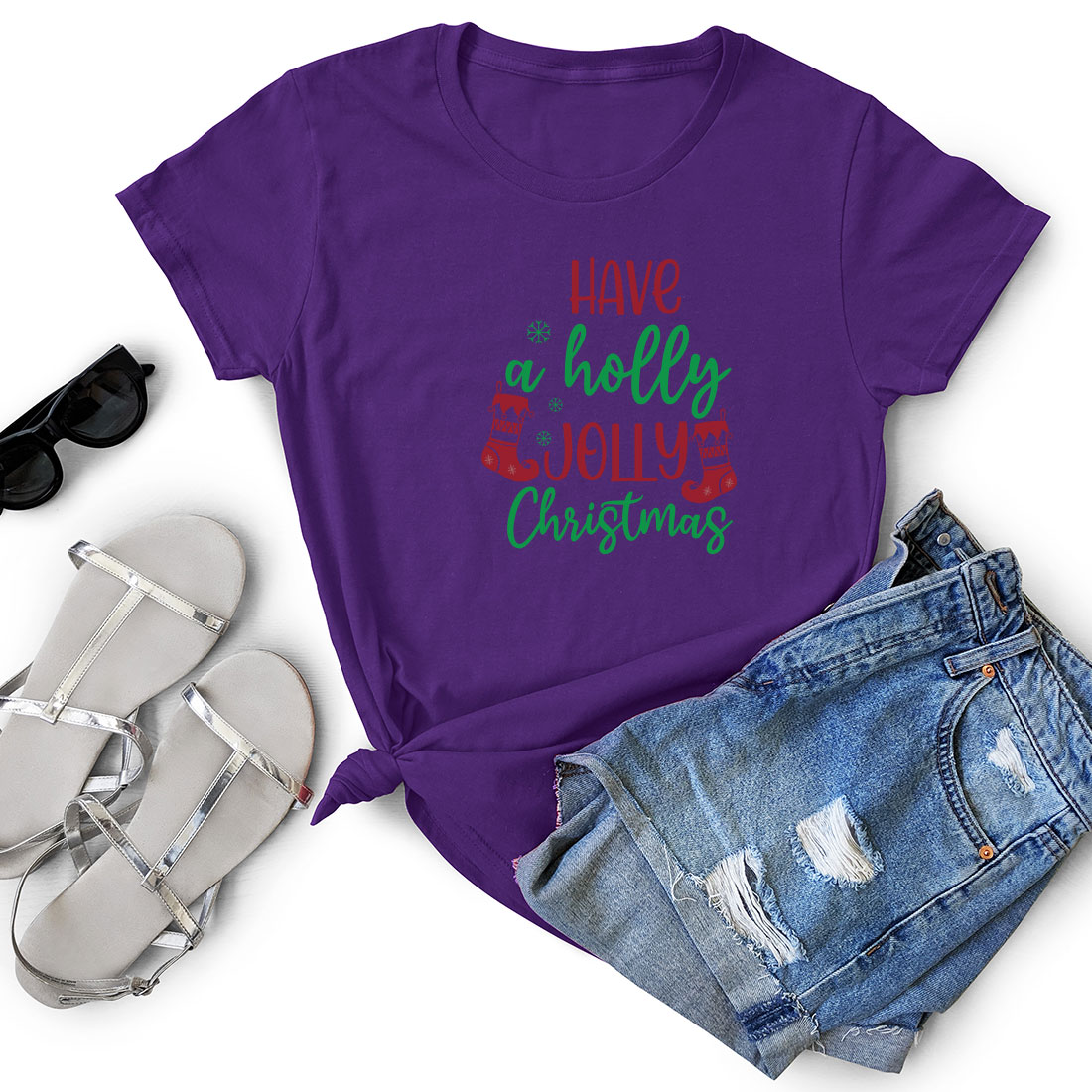 T - shirt that says live a holly christmas next to a pair of shorts.