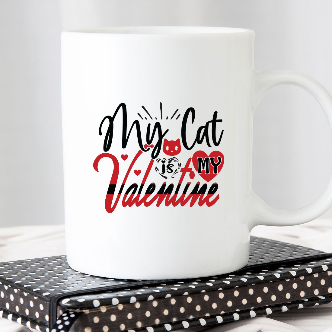 White coffee mug that says my cat is my valentine.