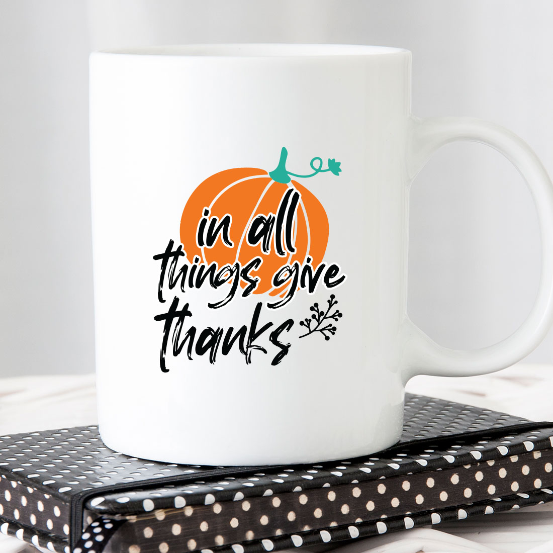 White coffee mug that says in all things give thanks.