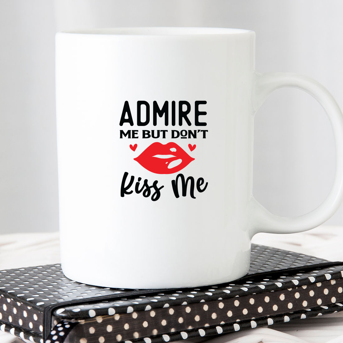 White coffee mug with the words admire me but don't kiss me.