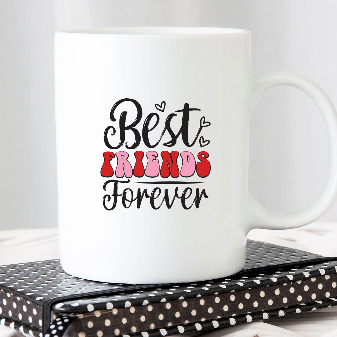 White coffee mug with the words best friends forever on it.