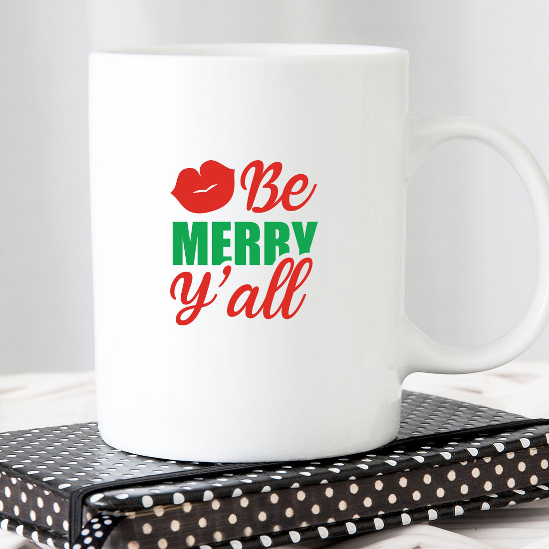 White coffee mug with the words be merry y'all on it.