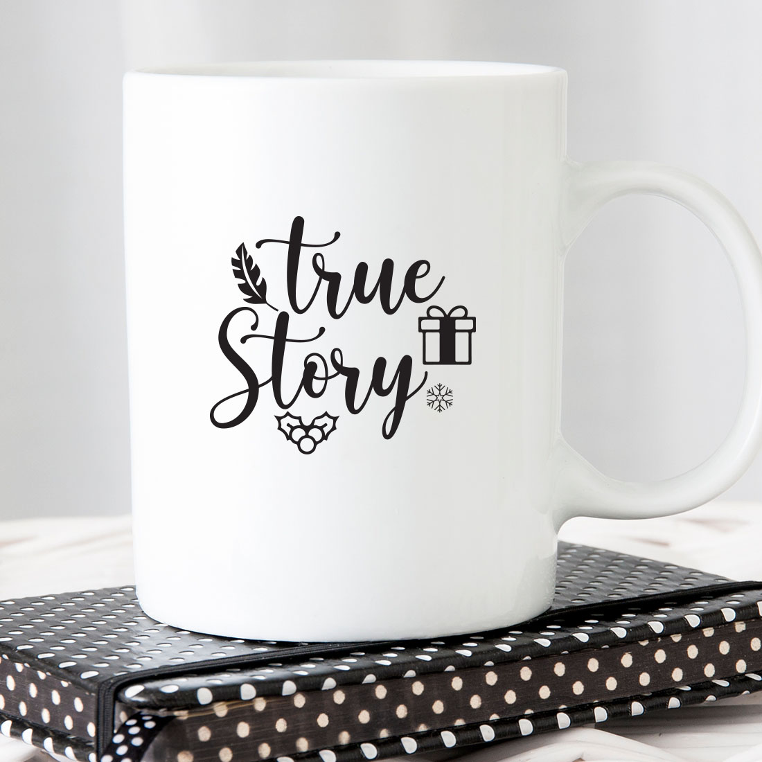 White coffee mug sitting on top of a book.