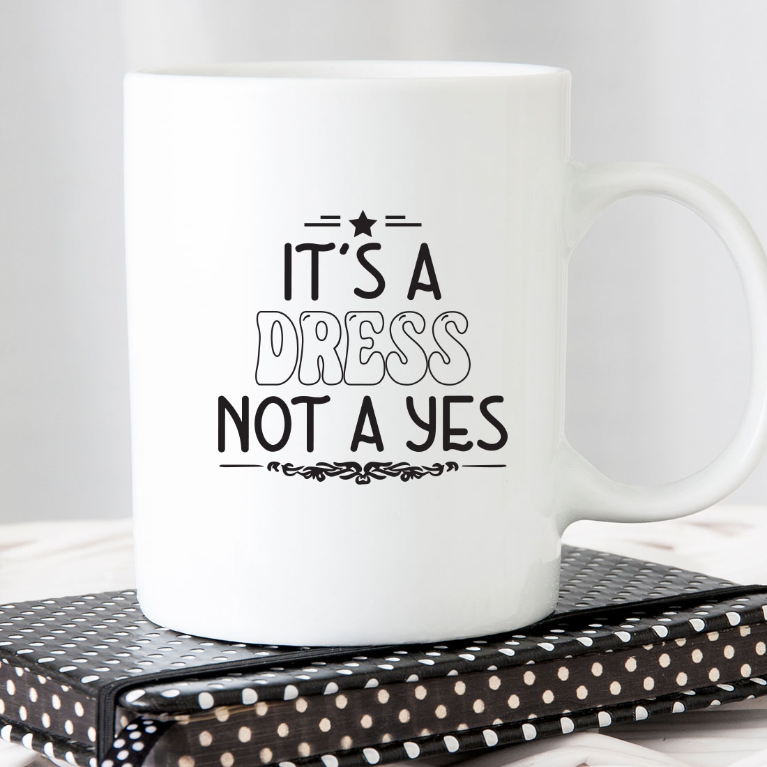 White coffee mug that says it's a dress not a yes.