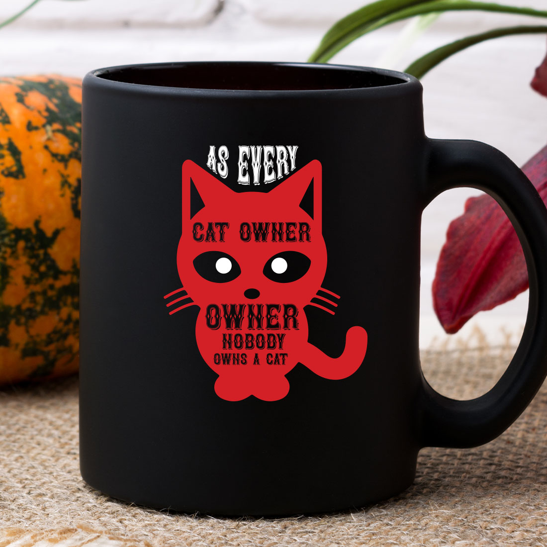 Black coffee mug with a red cat on it.
