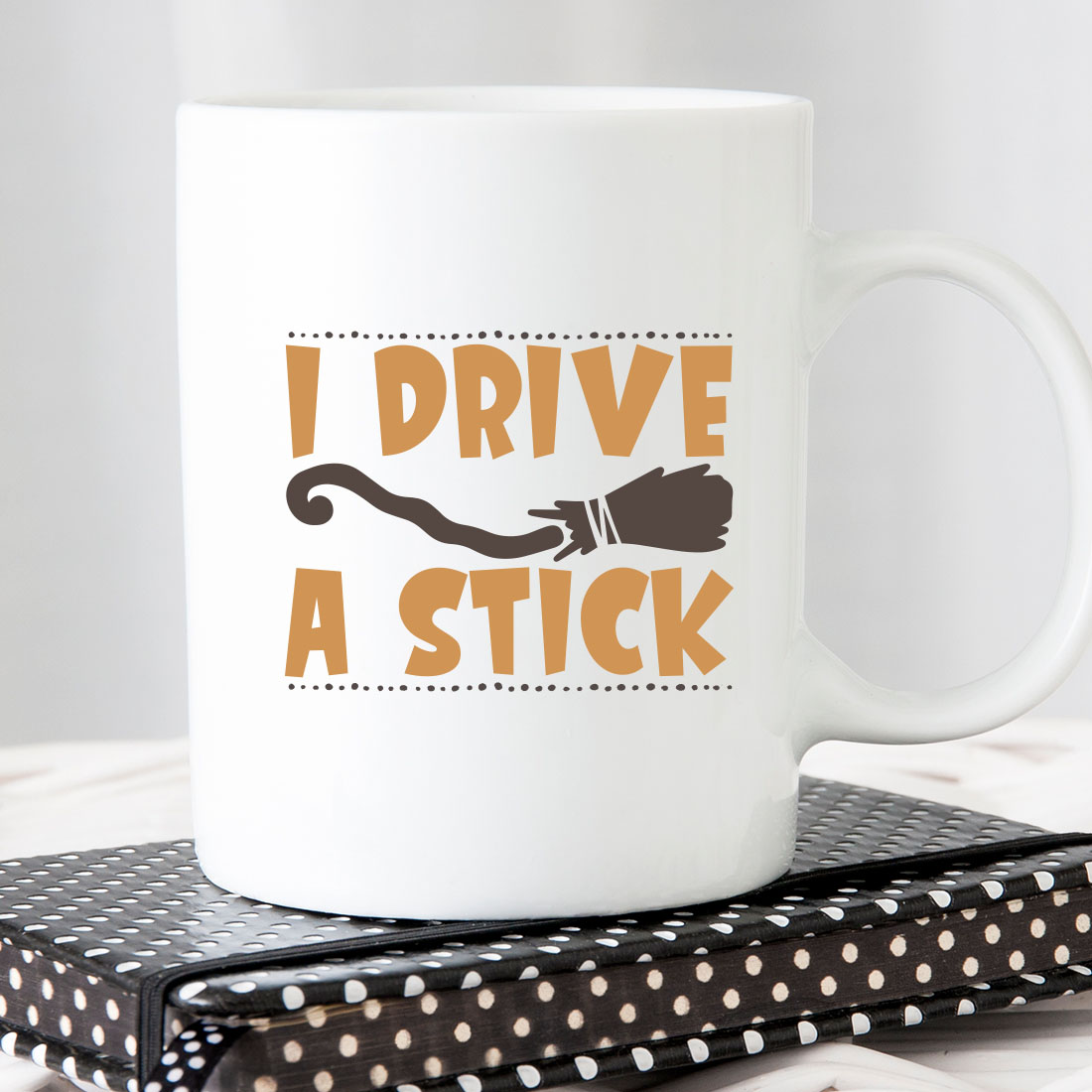White coffee mug that says i drive a stick.