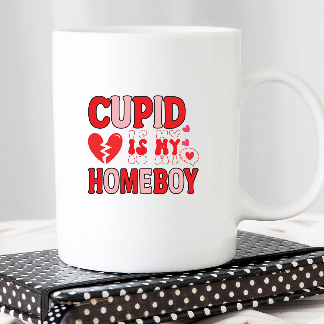 White coffee mug with the words cupd is my homeboy on it.