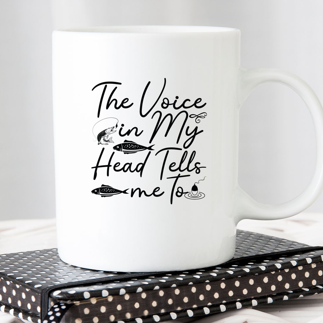 White coffee mug with the words the voice in my head tells me to.