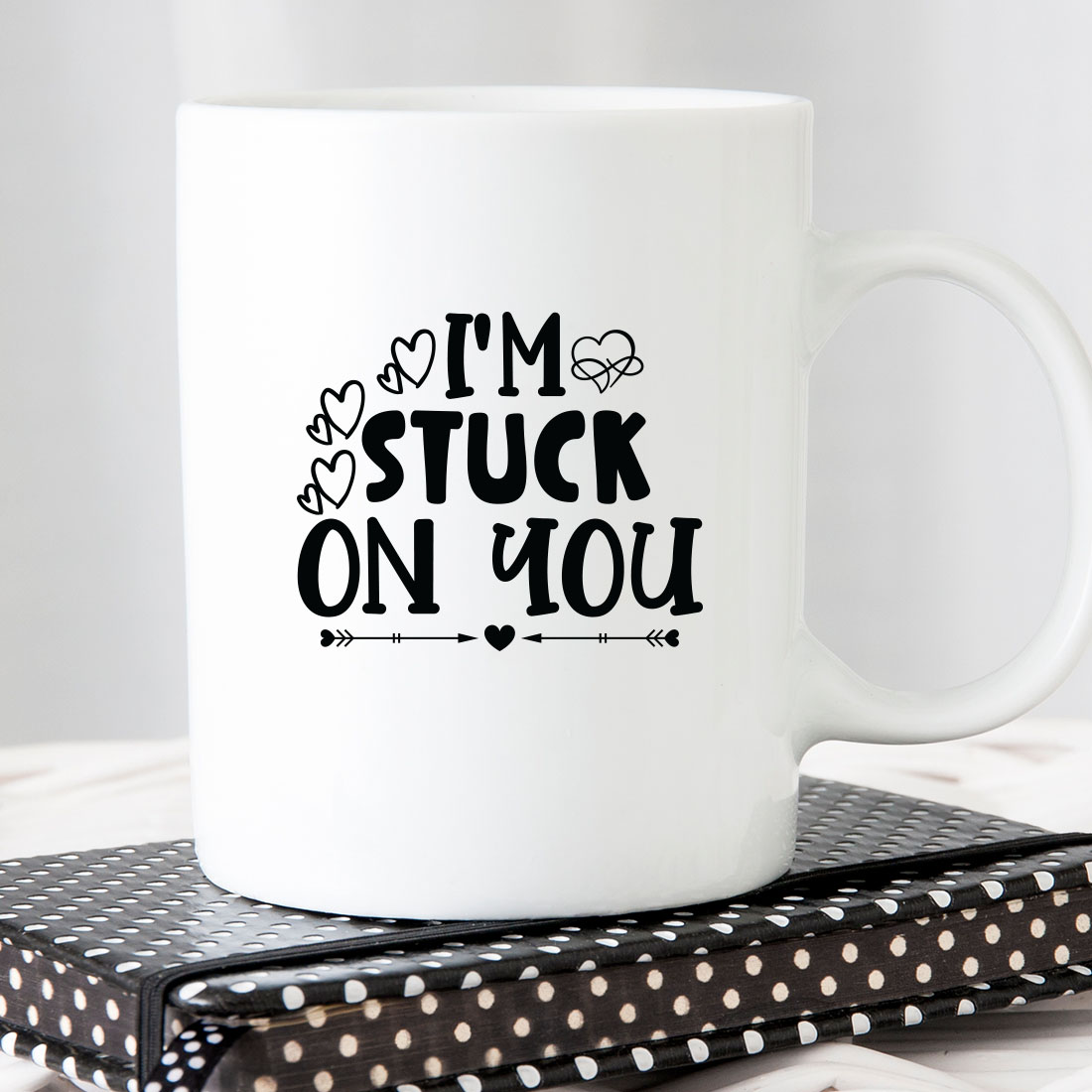 White coffee mug that says i'm stuck on you.