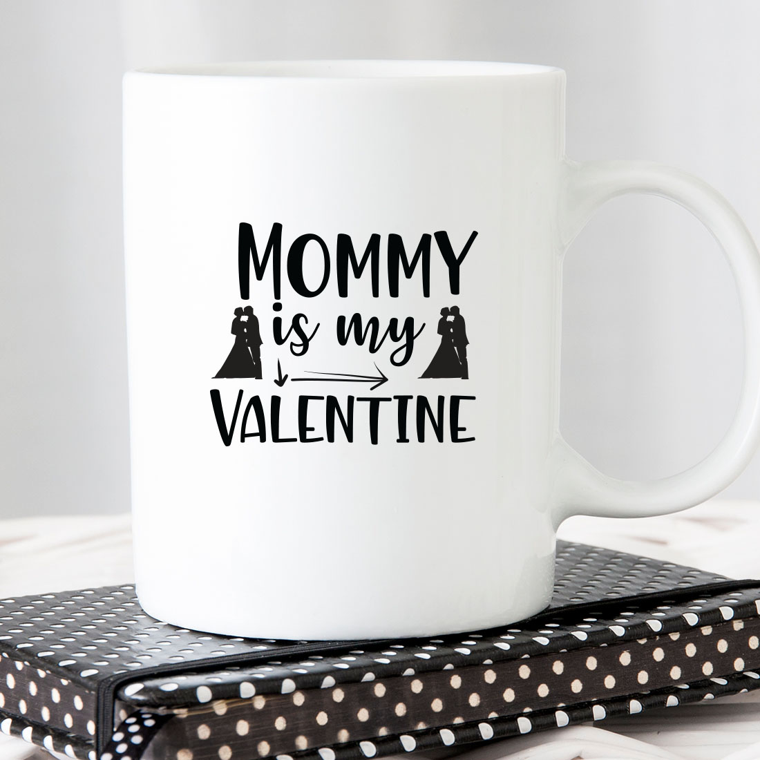 White coffee mug that says mommy is my valentine.