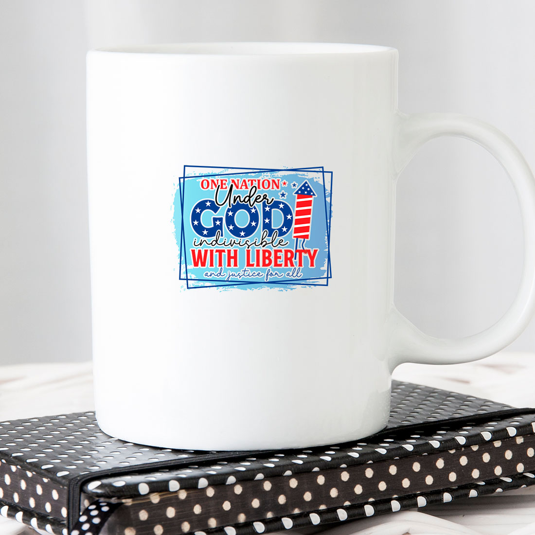 White coffee mug sitting on top of a book.