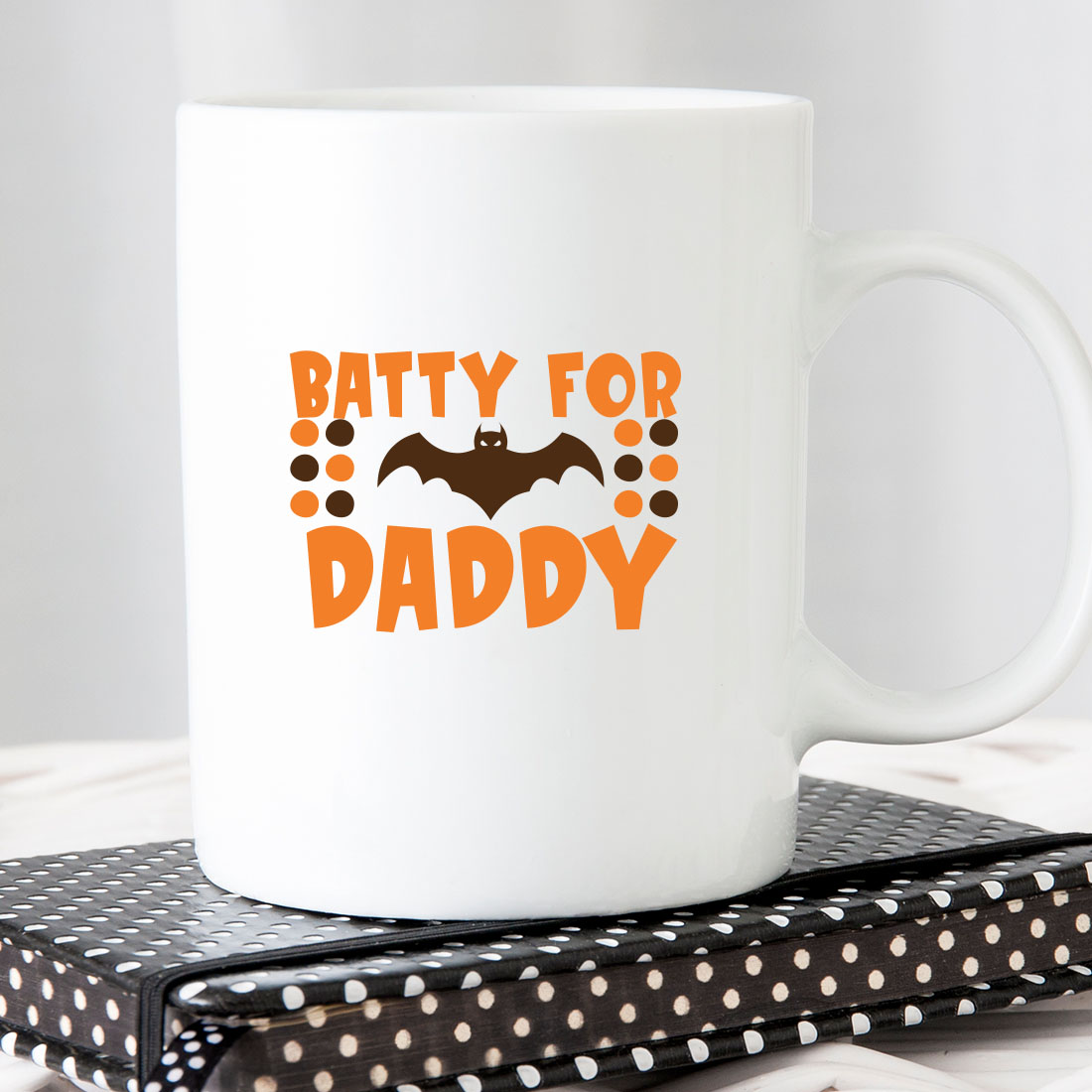 White coffee mug with a batty for daddy on it.