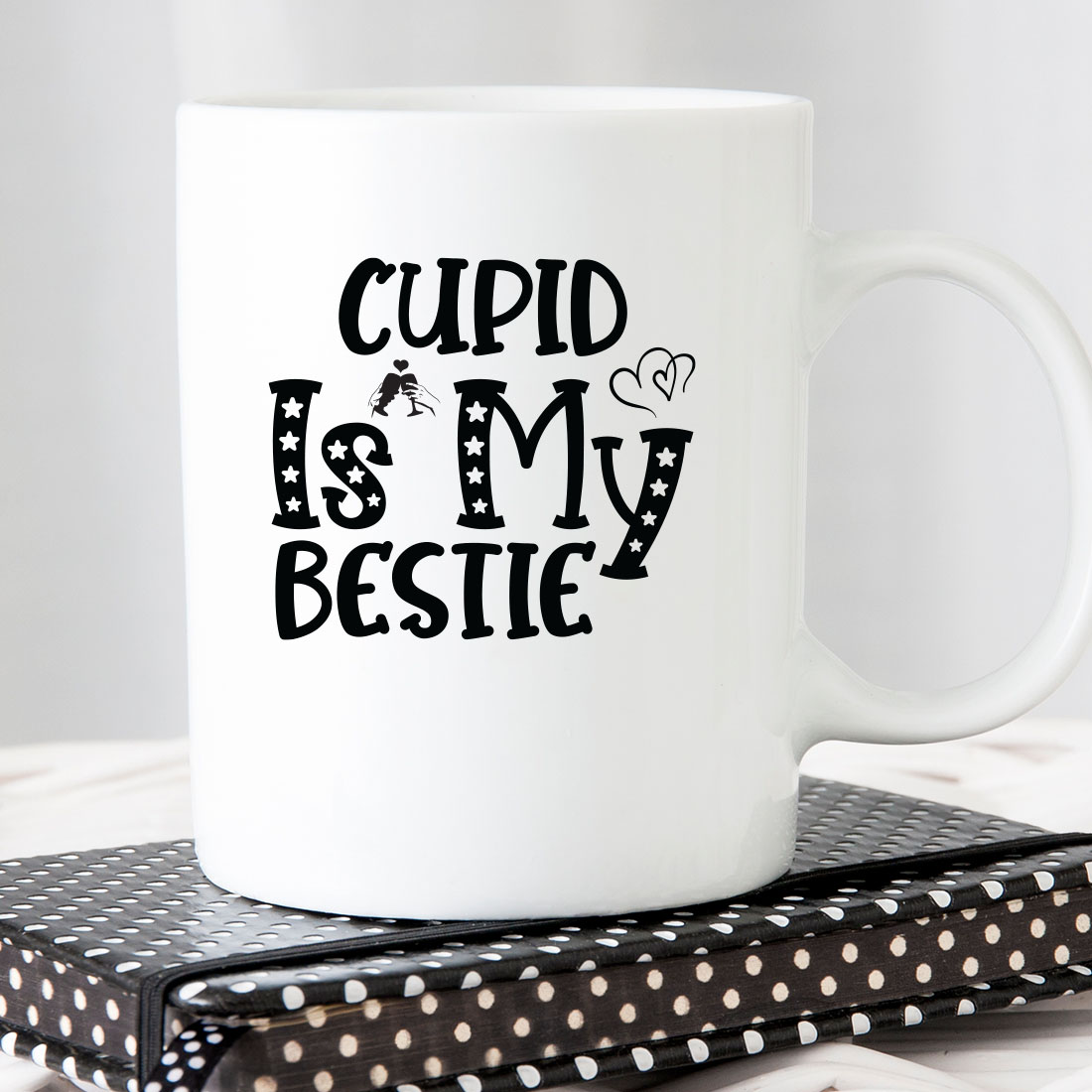 White coffee mug that says cupid is my bestie.