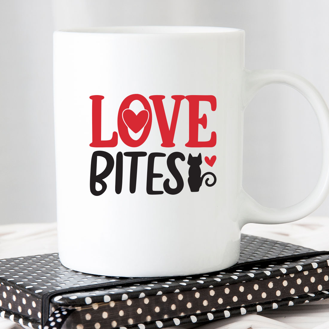 White coffee mug with the words love bites on it.