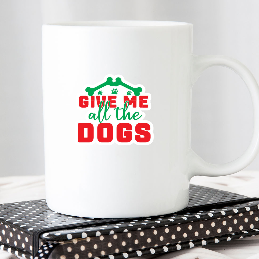 White coffee mug with the words give me all the dogs on it.