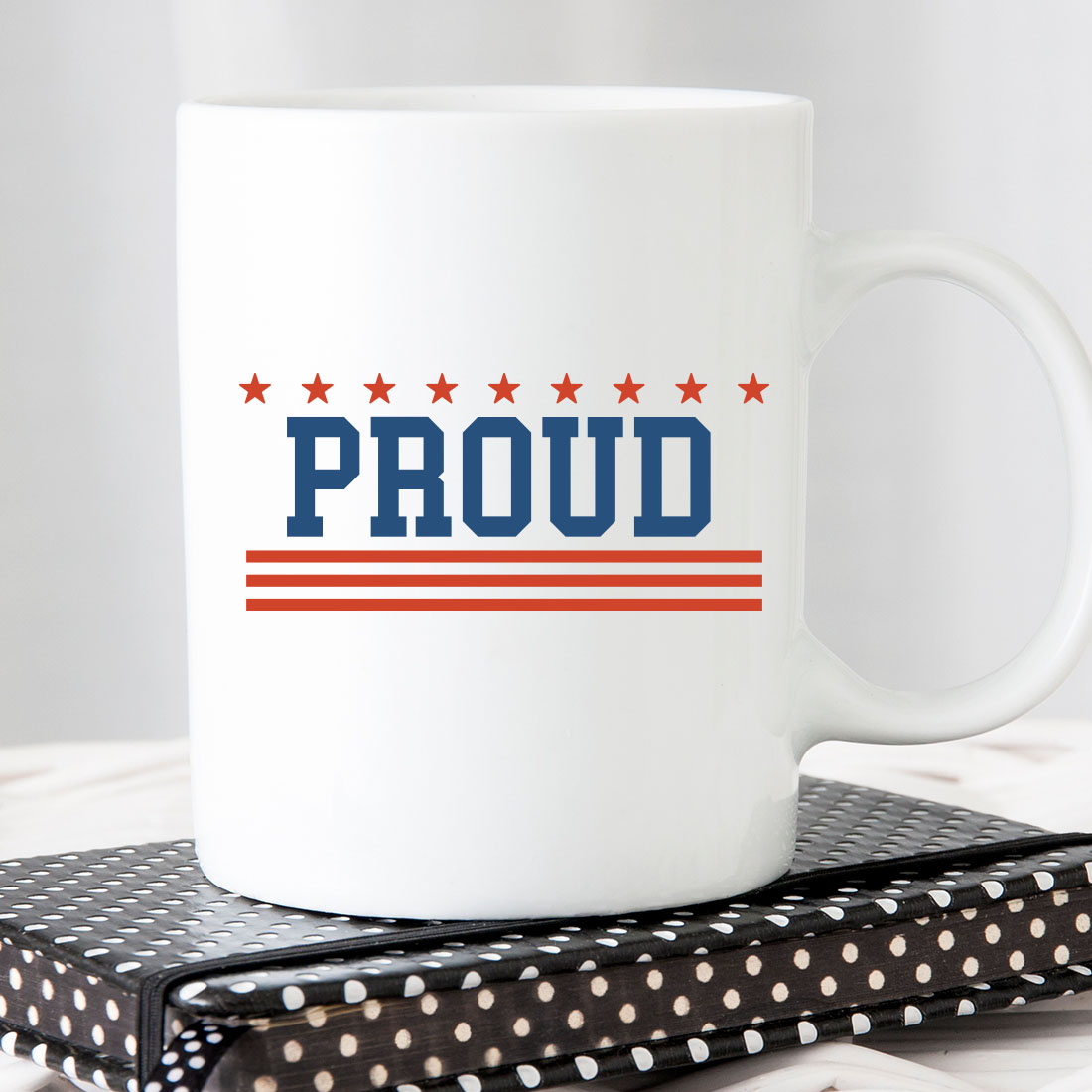 White coffee mug with the word proud on it.