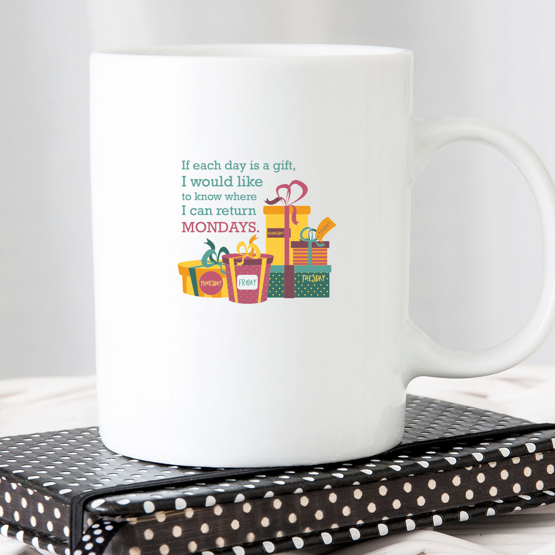 White coffee mug sitting on top of a book.