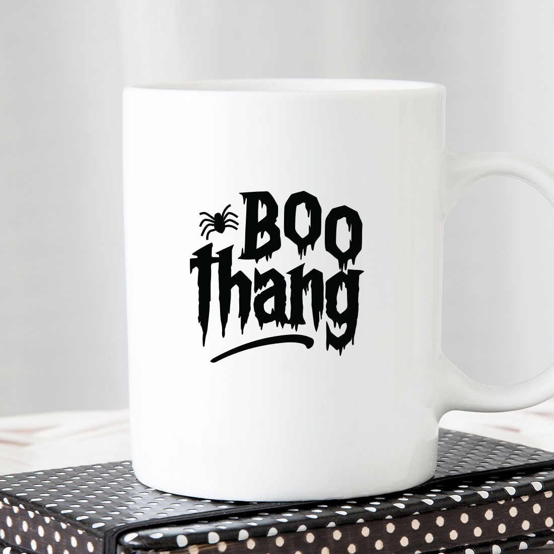 White coffee mug with the words boo thang printed on it.