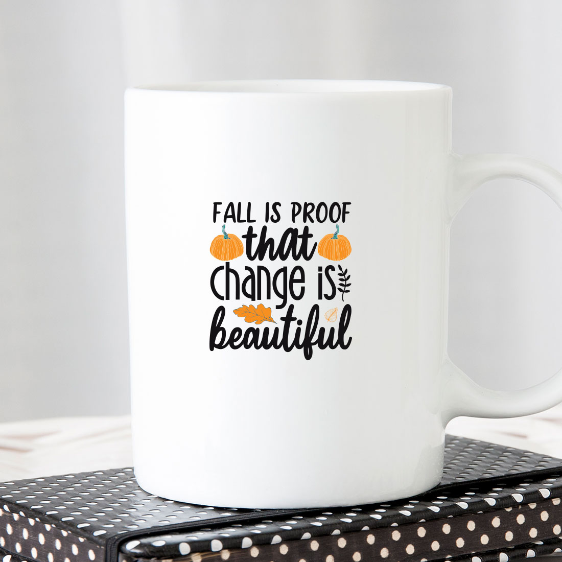 White coffee mug that says fall is proof that change is beautiful.