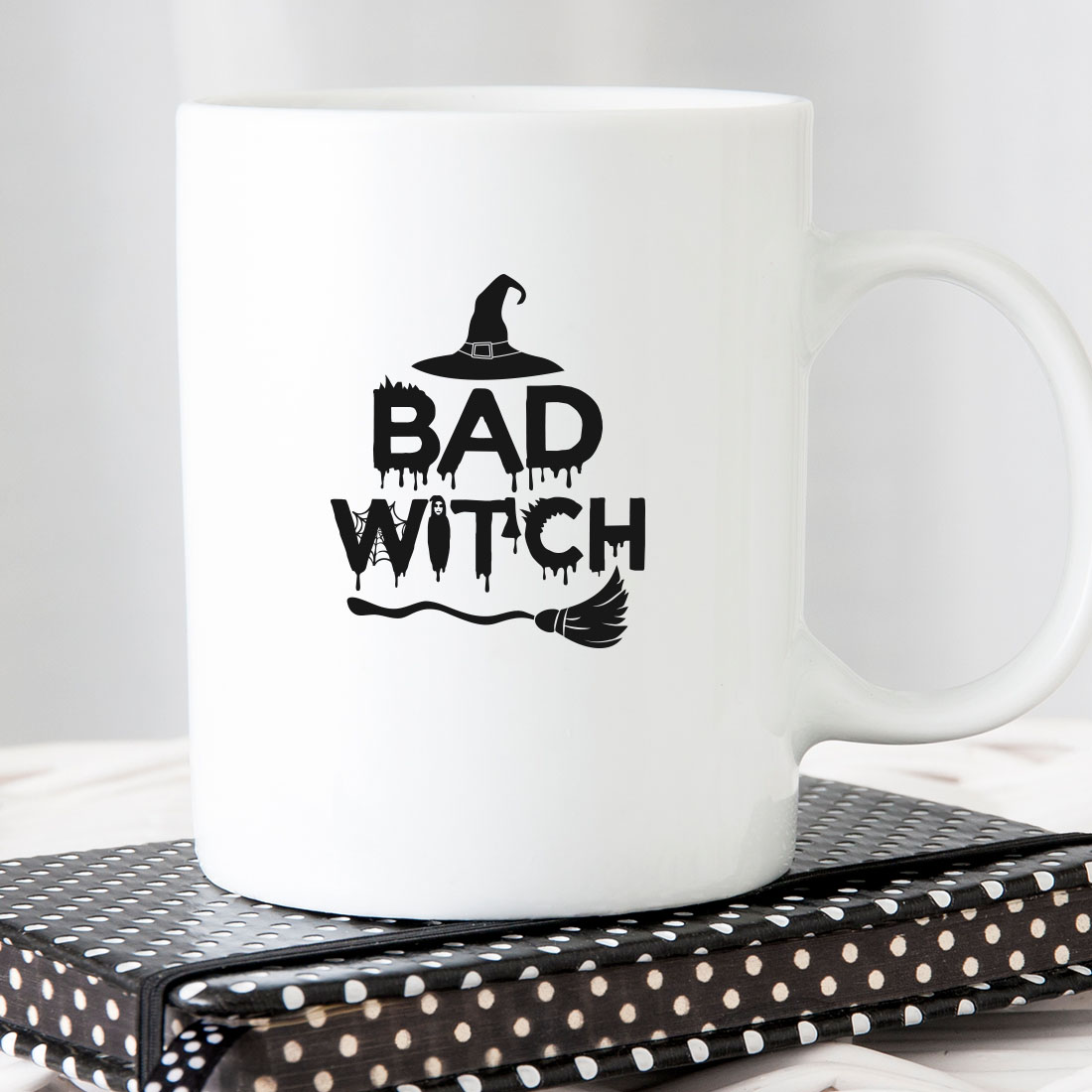 White coffee mug with the words bad witch on it.