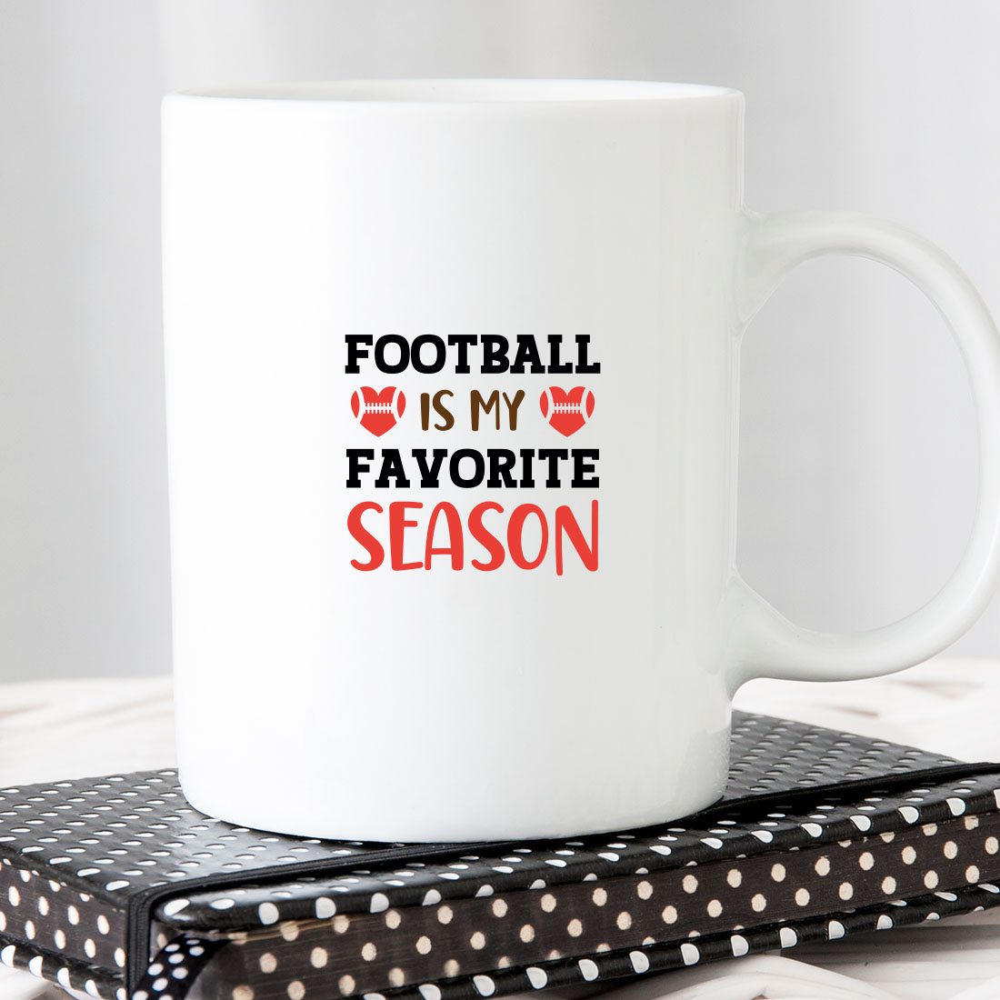 White coffee mug that says football is my favorite season.