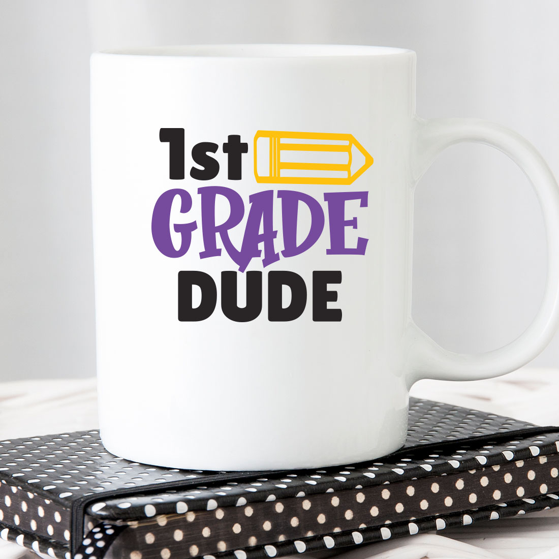 White coffee mug with the words 1st grade dude on it.