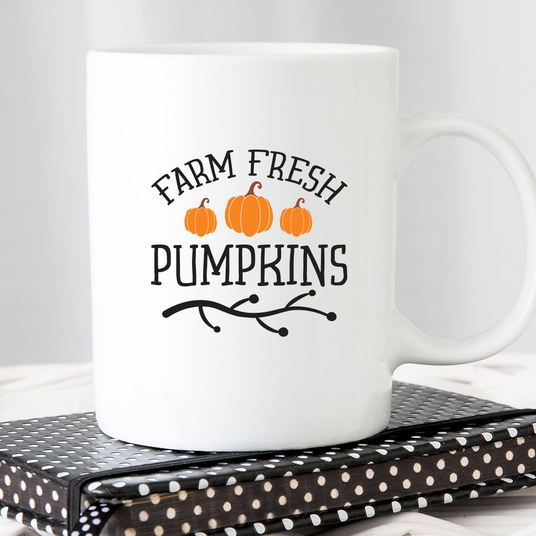 White coffee mug that says farm fresh pumpkins.