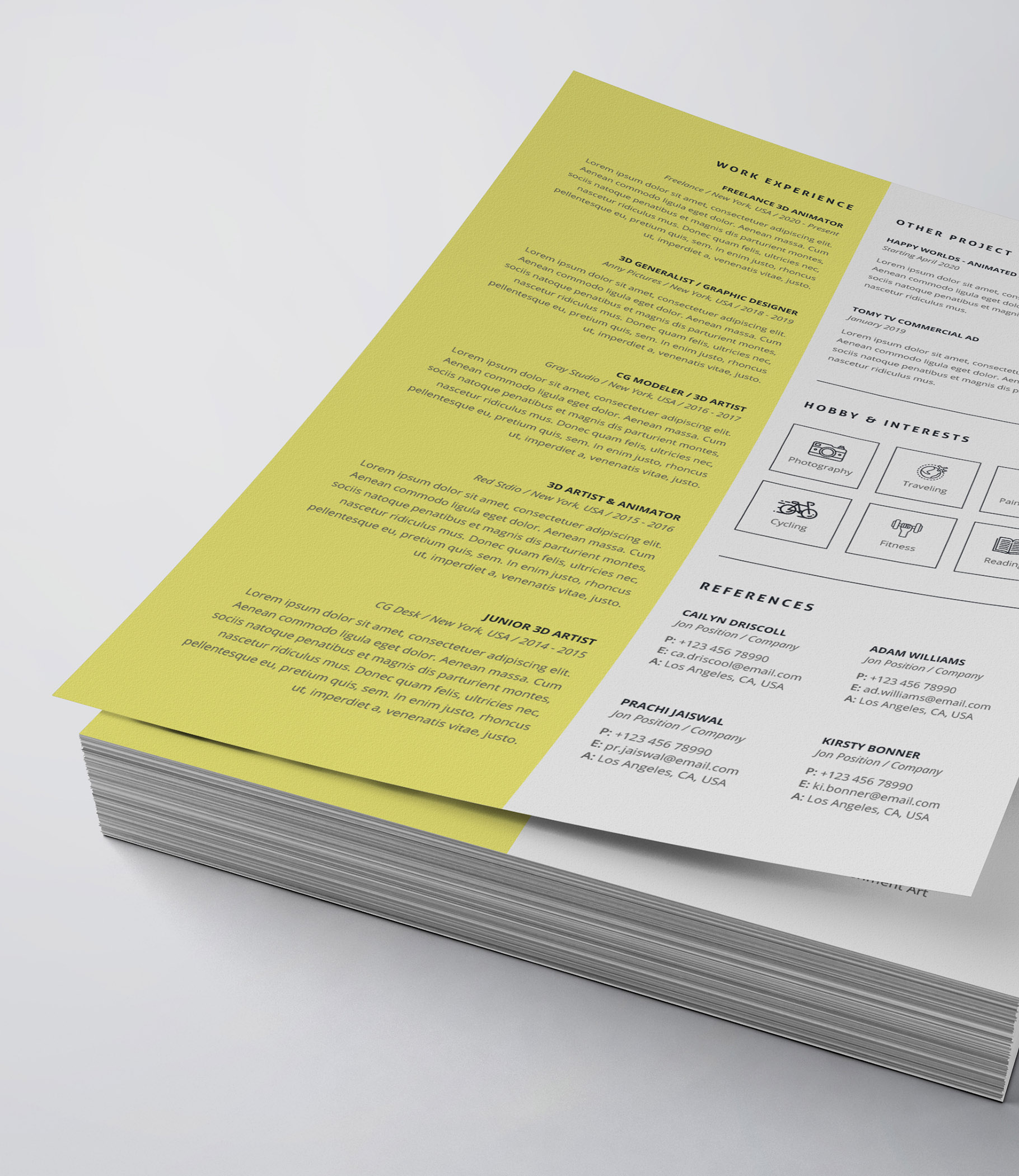 Yellow and white resume is stacked on top of each other.