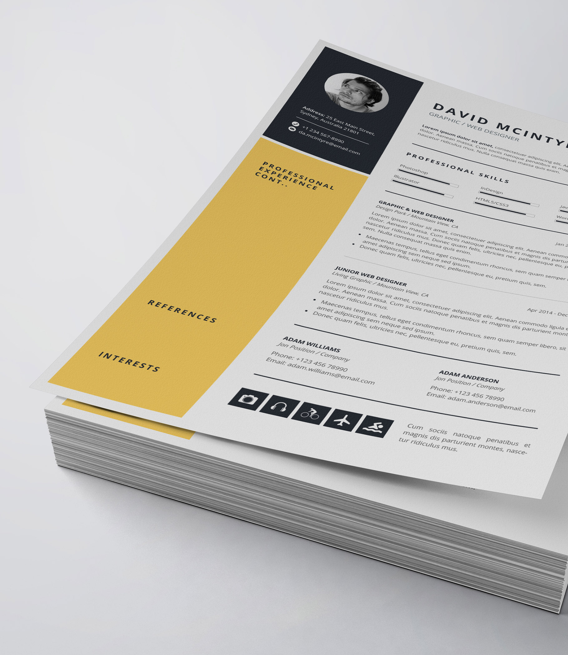 Yellow and black resume on top of a stack of papers.