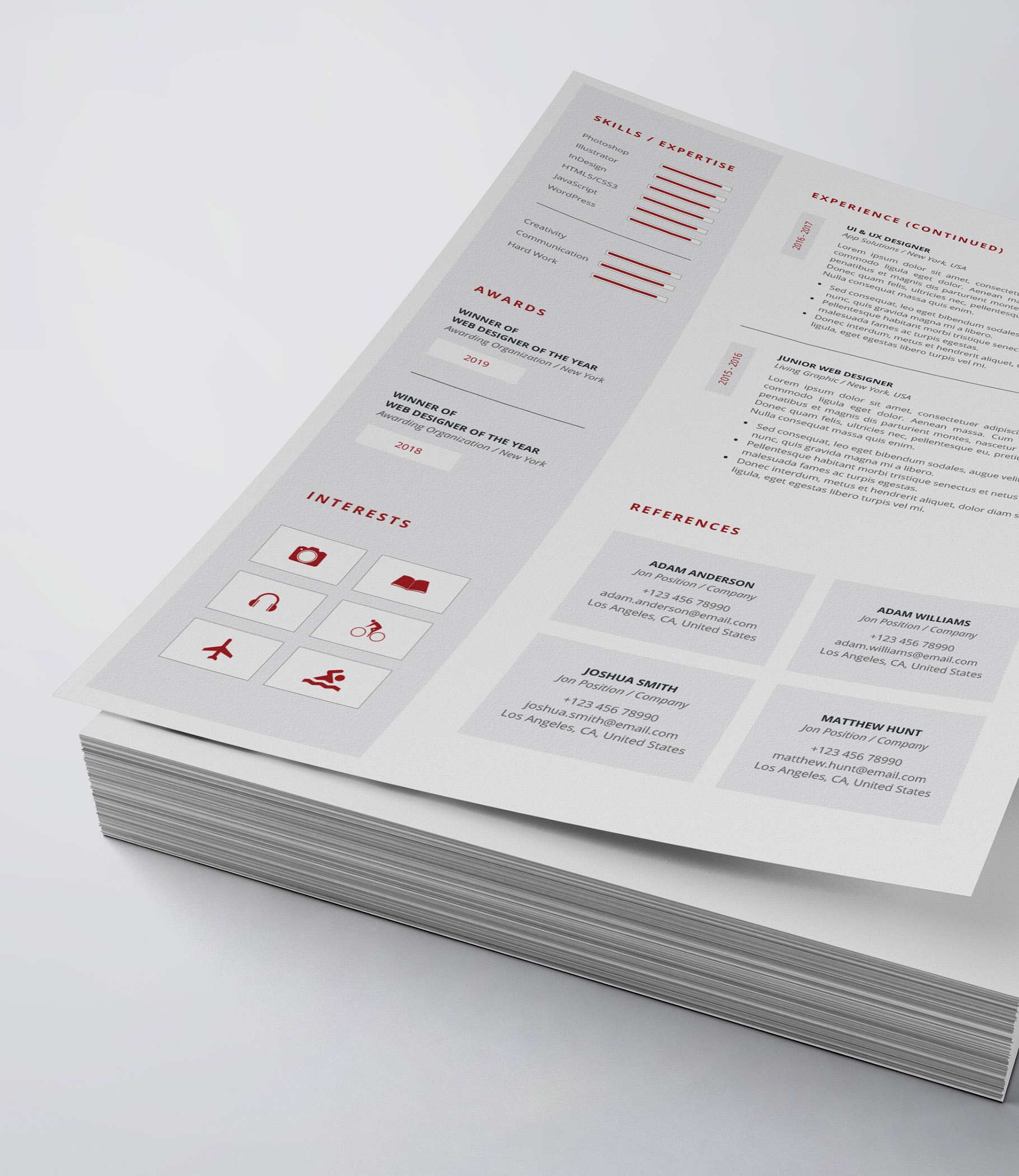 White and red resume on top of a stack of papers.