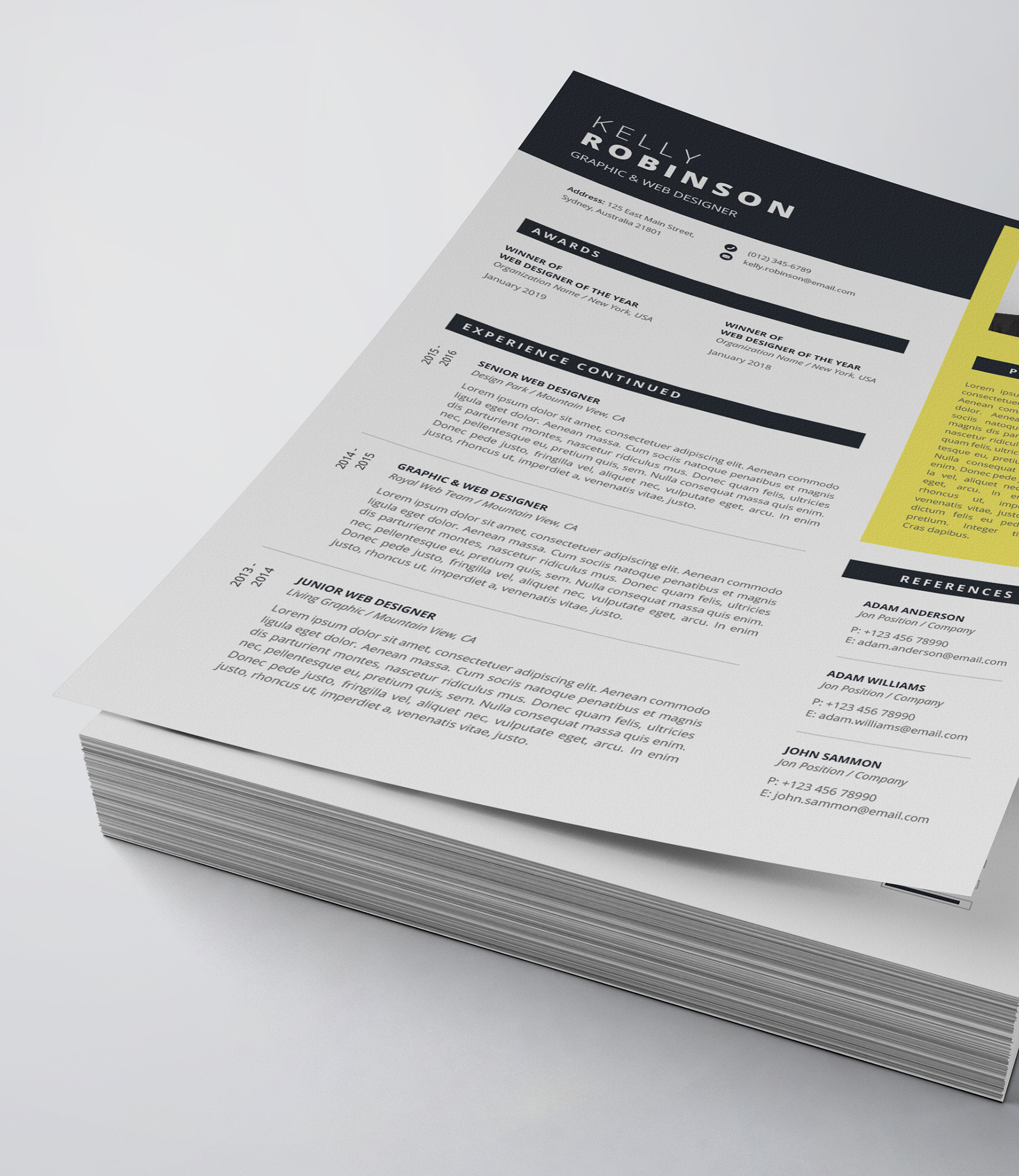 Yellow and black resume on top of a stack of papers.