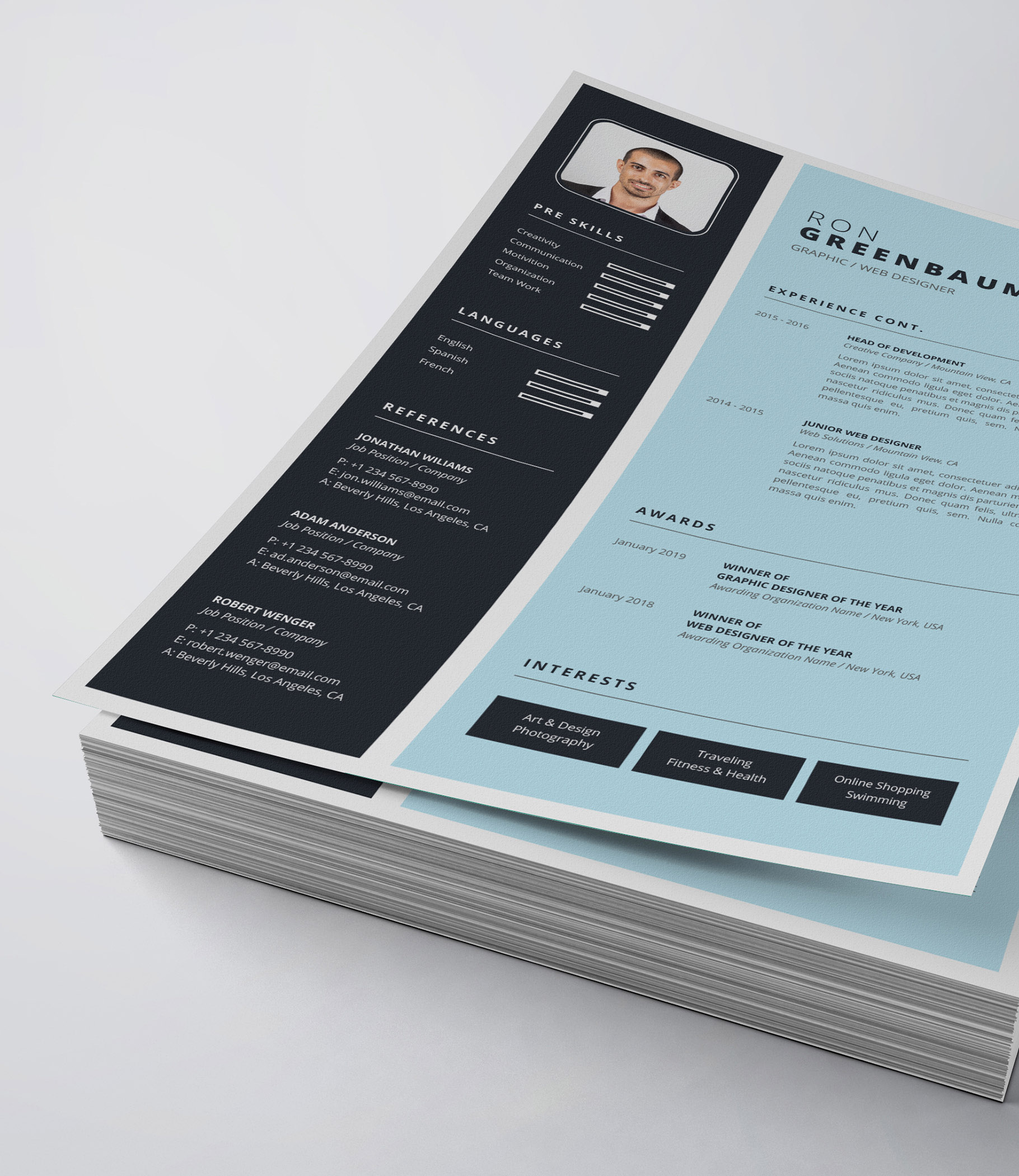 Blue and black resume on top of a stack of papers.