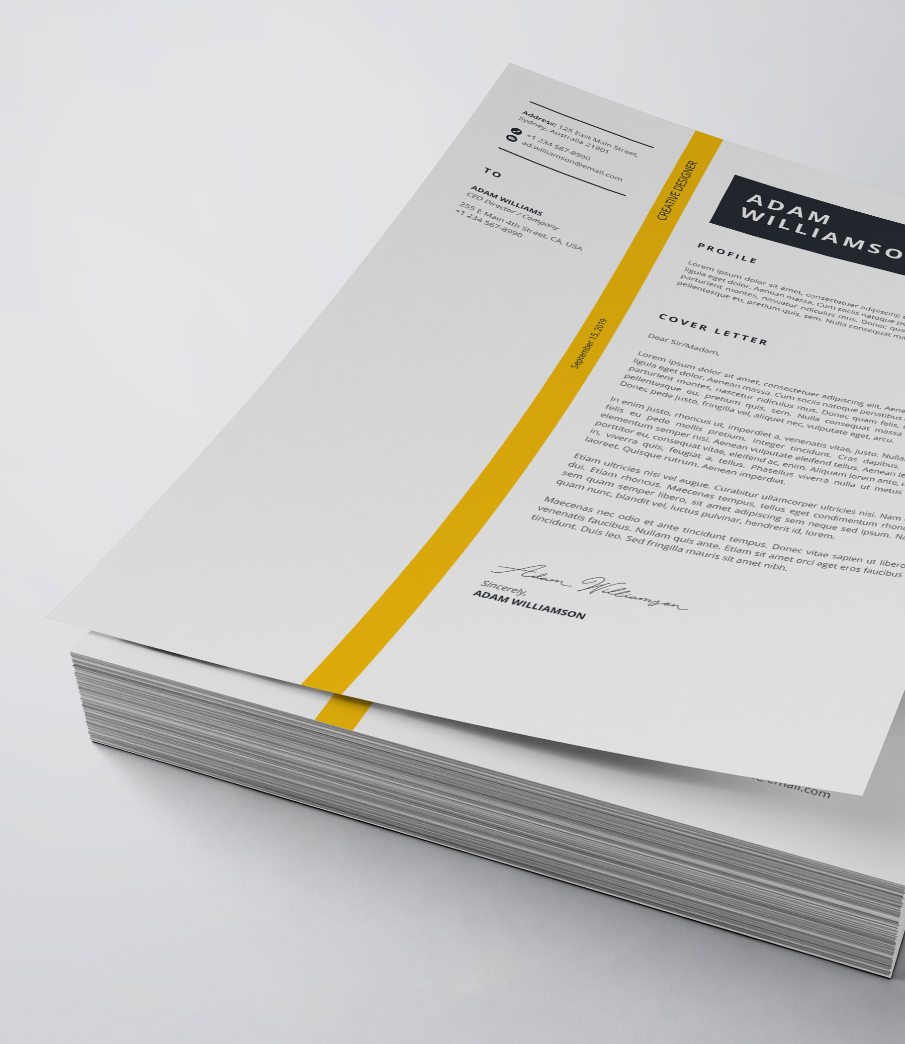 White and yellow cover letter sitting on top of a stack of papers.