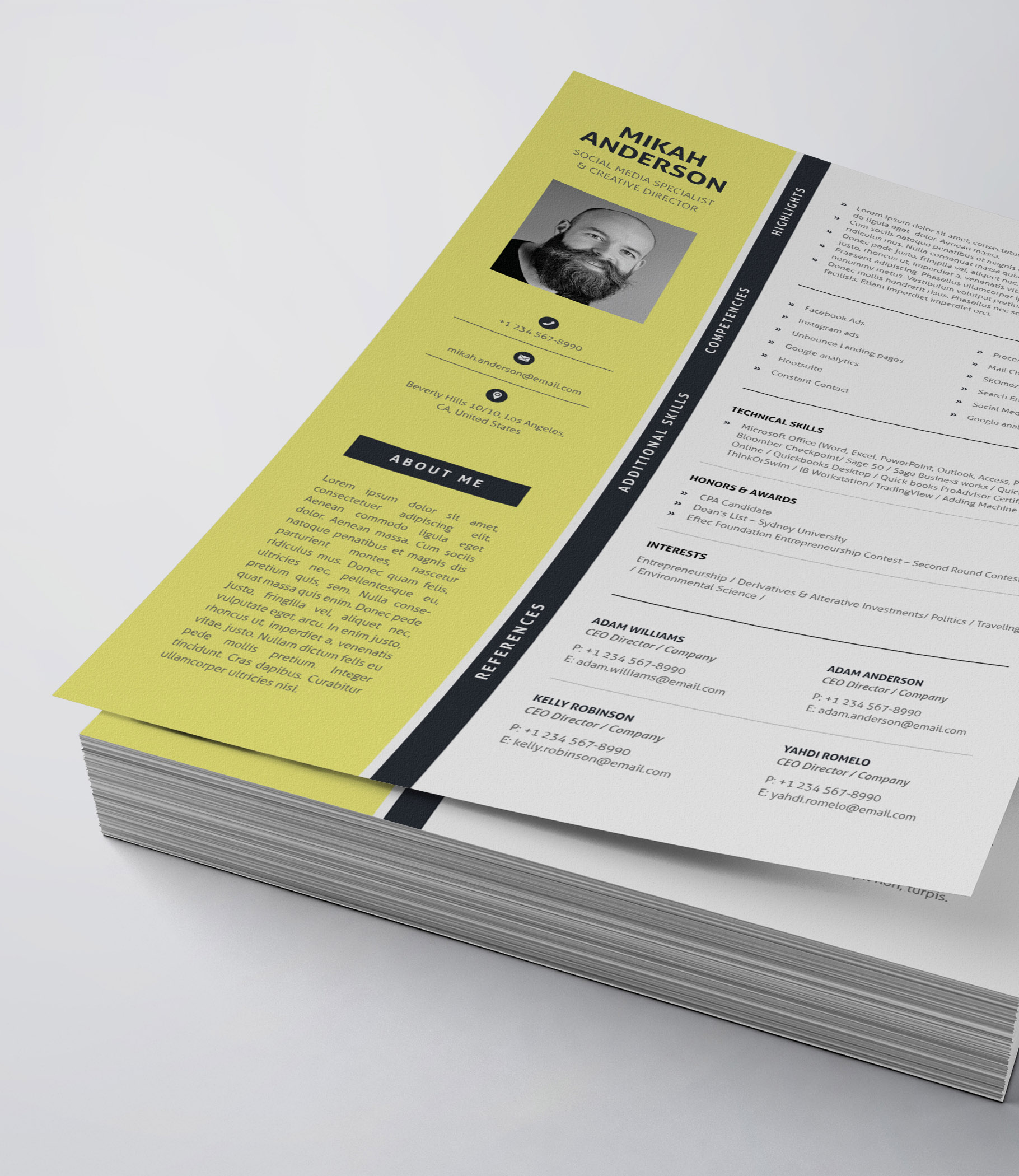 Yellow and black resume is stacked on top of each other.