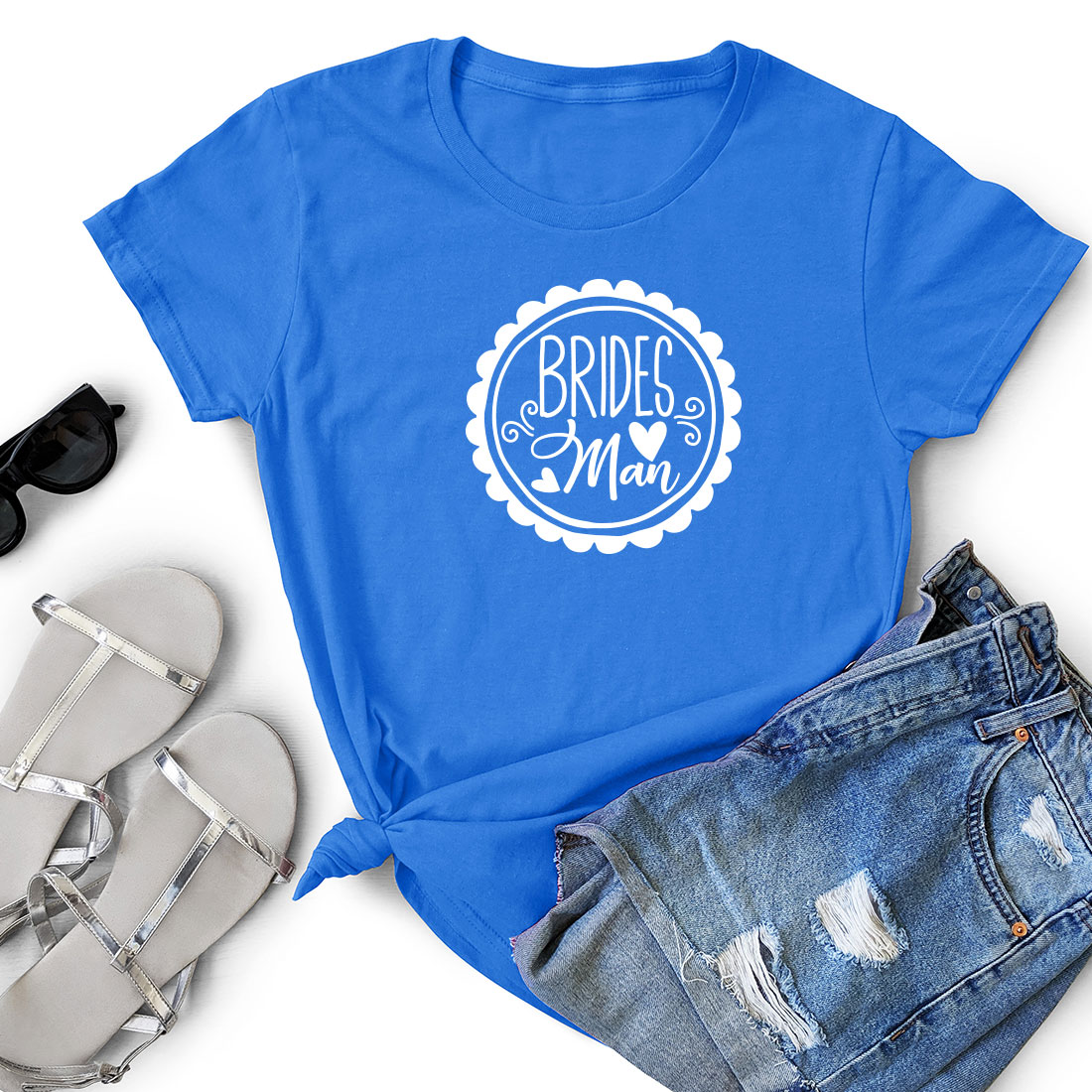 Blue t - shirt with the words bride and a pair of shorts.