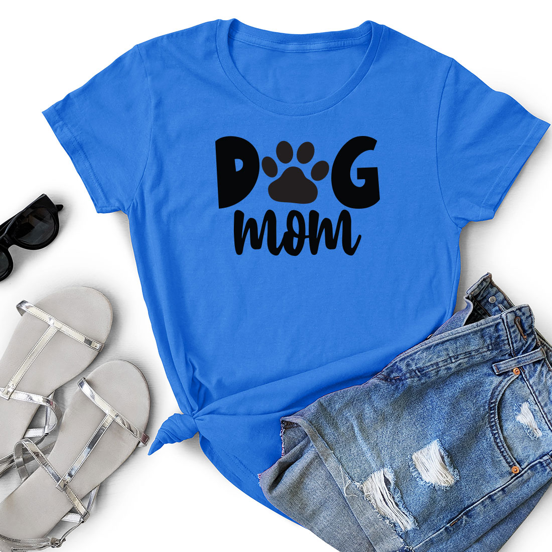 T - shirt that says dog mom next to a pair of shorts.