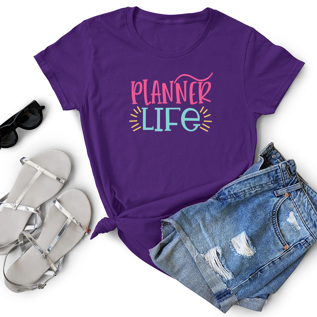 T - shirt that says planner life next to a pair of shorts.