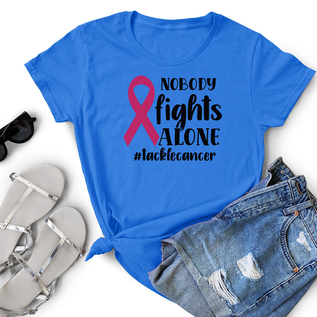 T - shirt that says nobody fights alone with a pink ribbon.