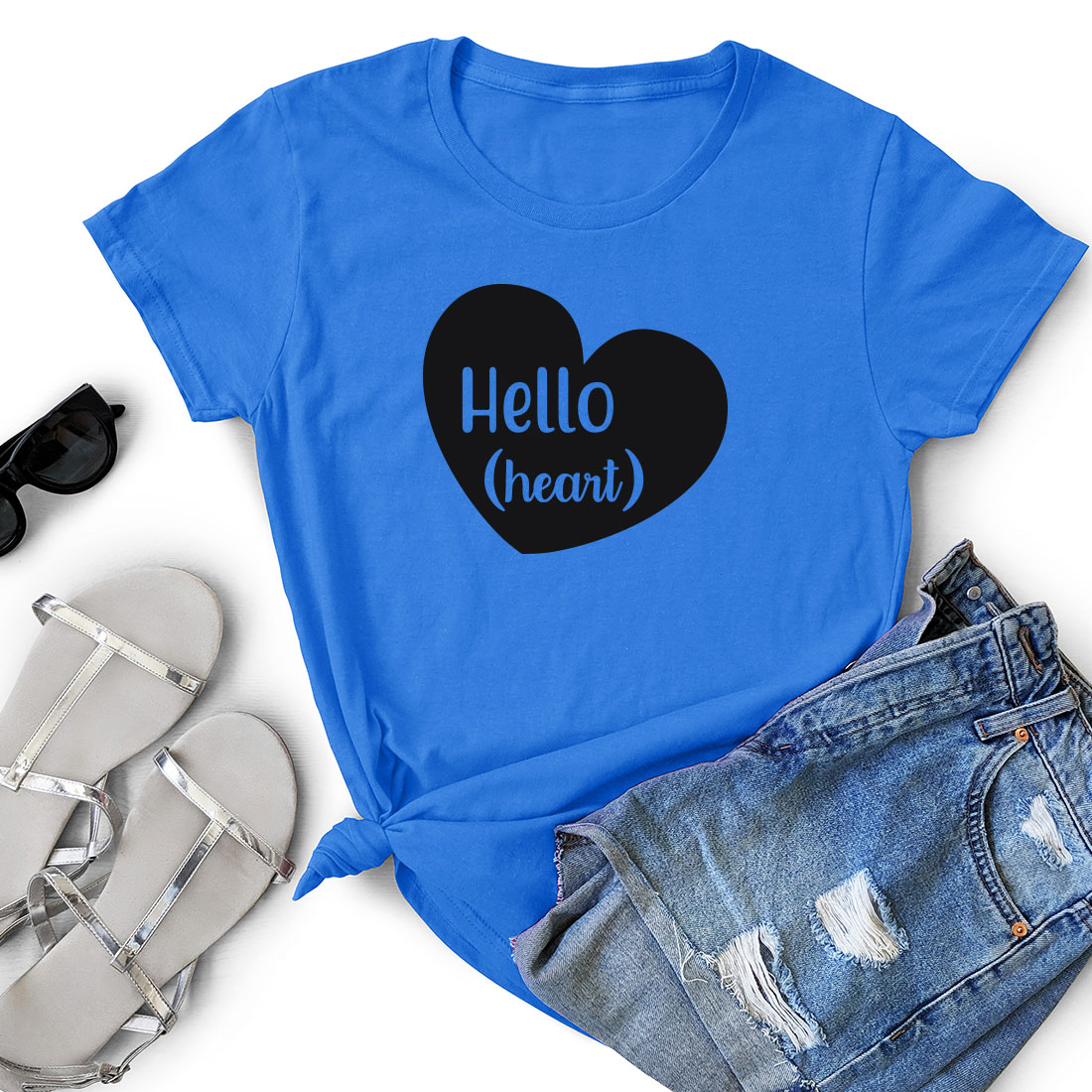 T - shirt with the words hello heart on it next to a pair of.
