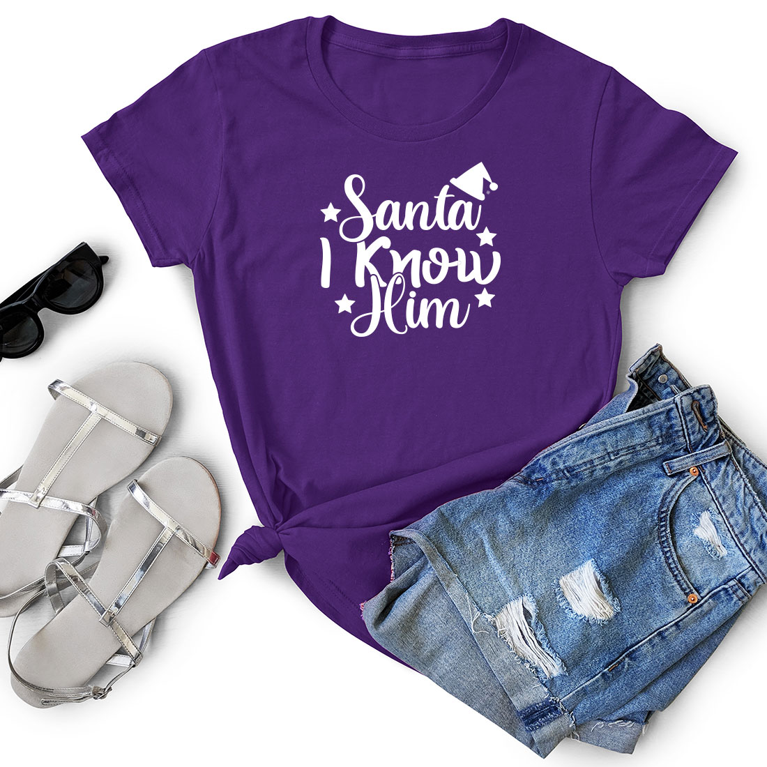 T - shirt that says sanda know him next to a pair of shorts.